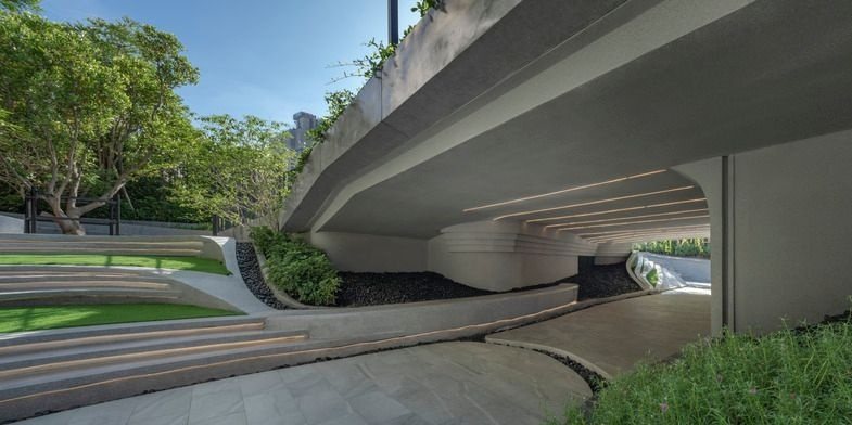 Landscaped garden and walkway at the base of the tower