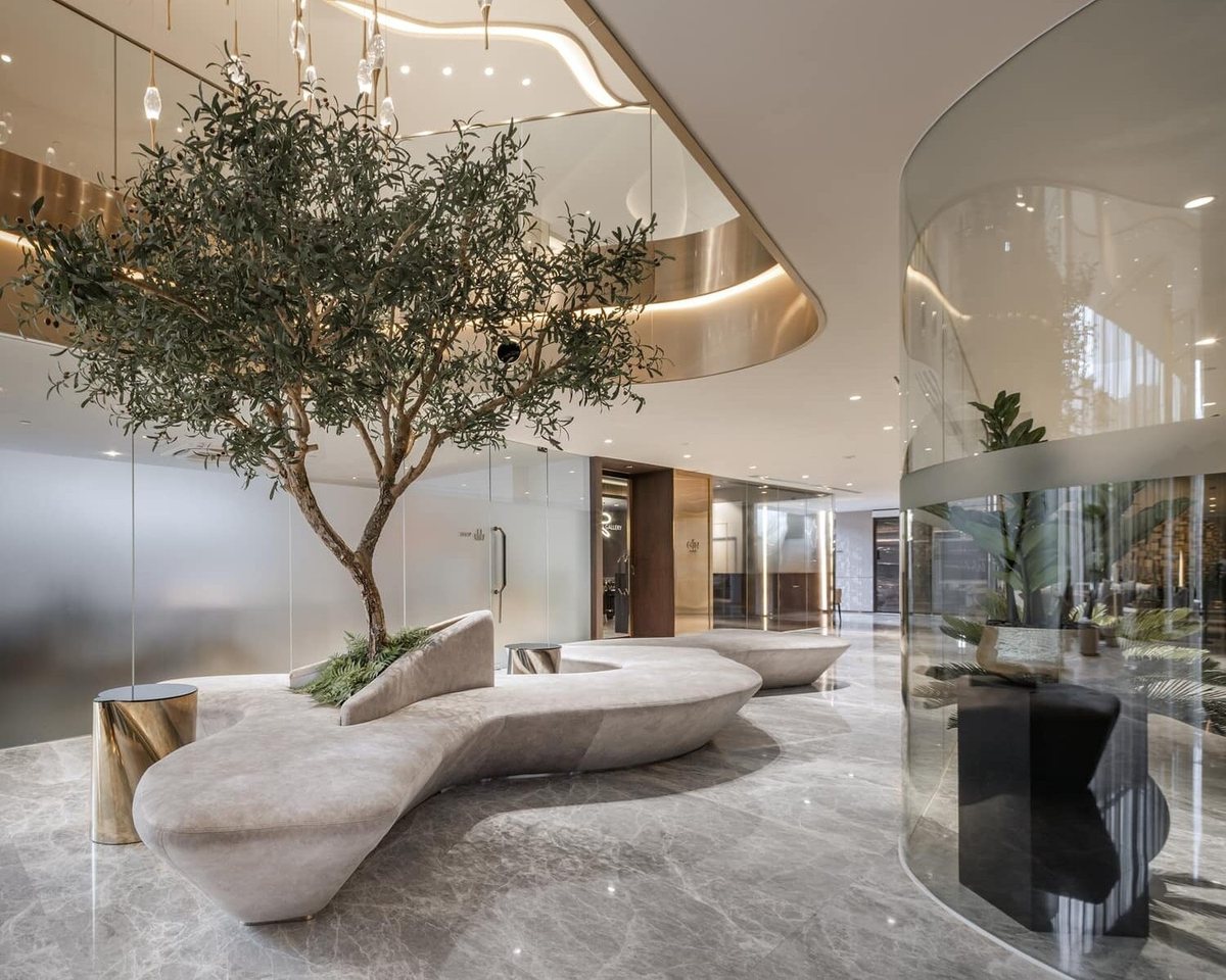 Lobby lounge with a tree and sculptural seating