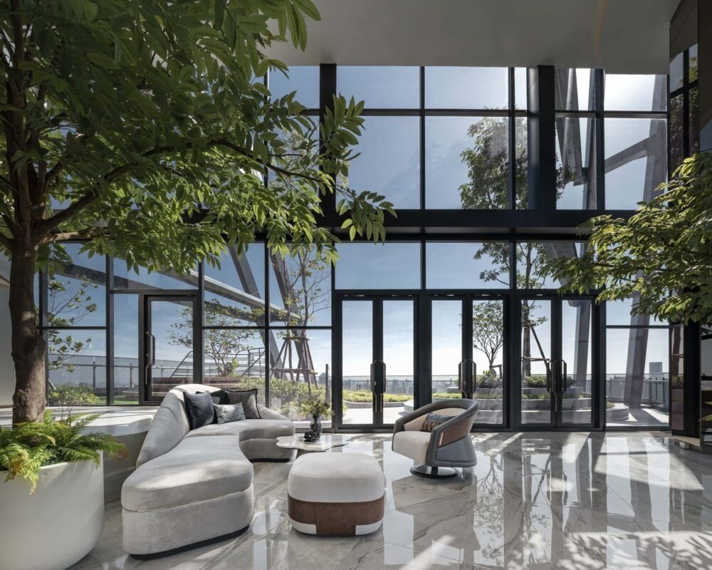 Sky lounge with floor-to-ceiling windows and trees
